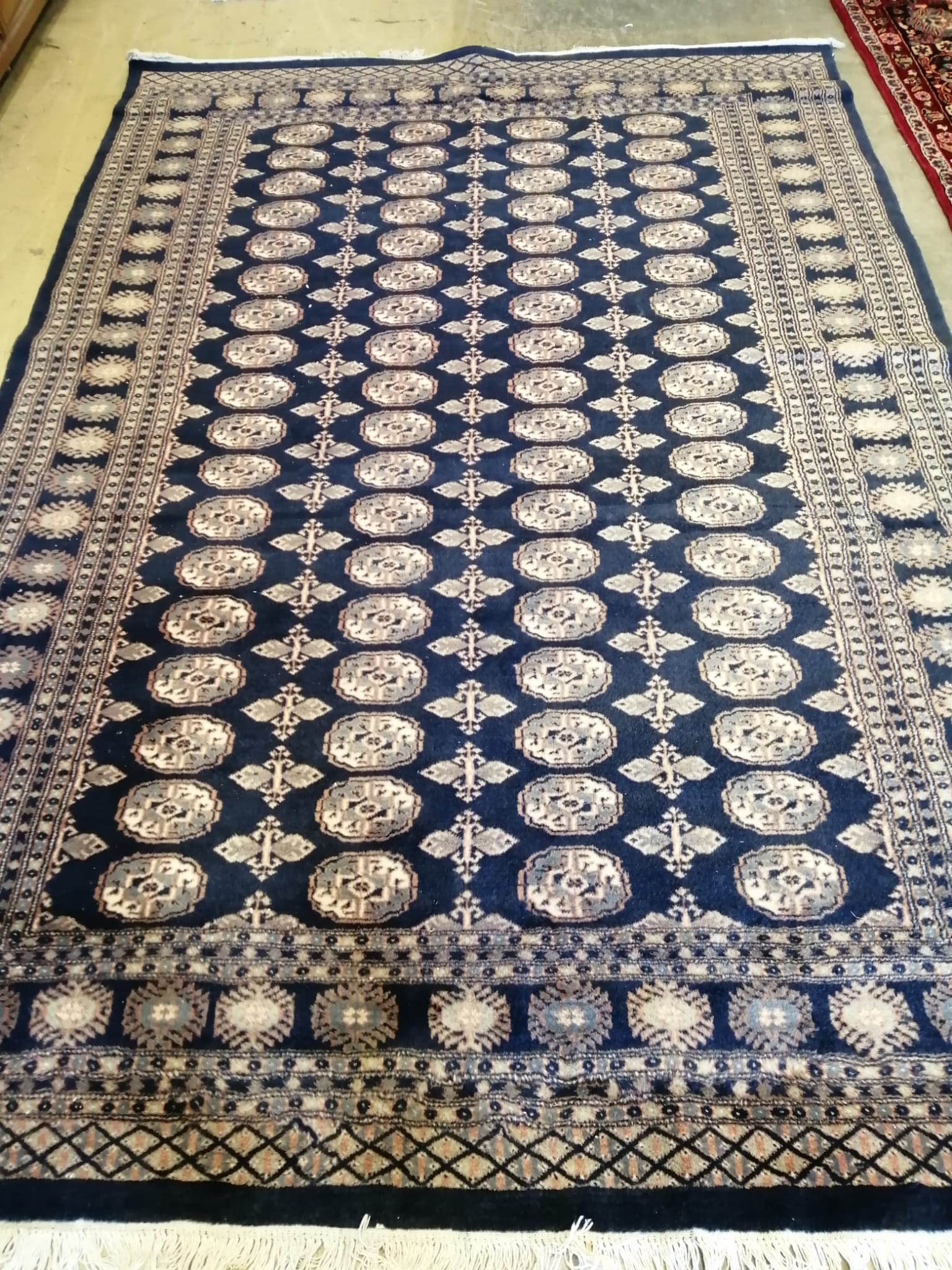 A Bokhara blue ground carpet, 270 x 186cm